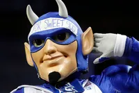 Duke's Blue Devil Found Sitting Alone in an Empty Arena Corridor, Refusing to Accept That the Game Is Over